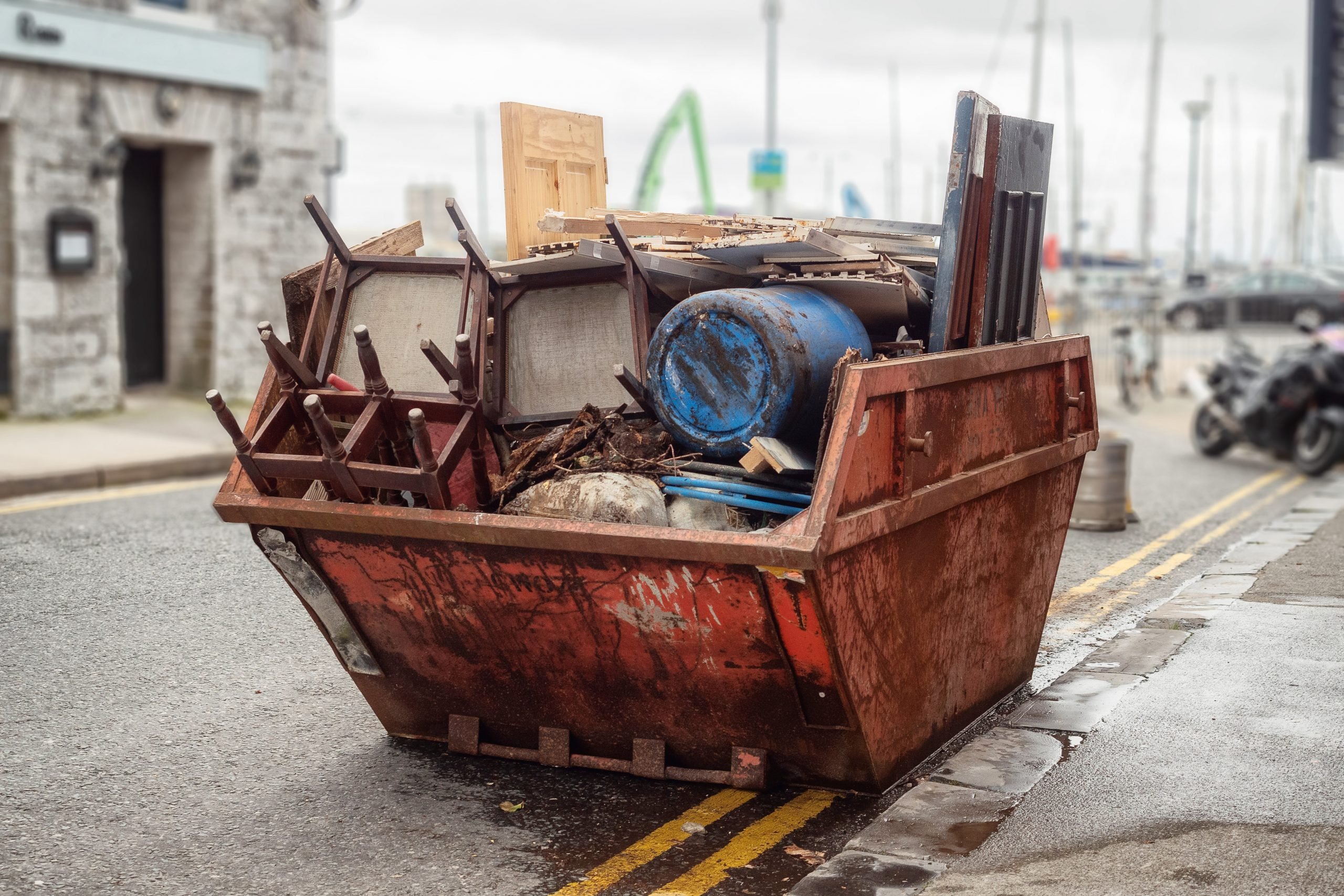 commercial skip on the side of the road in Batley