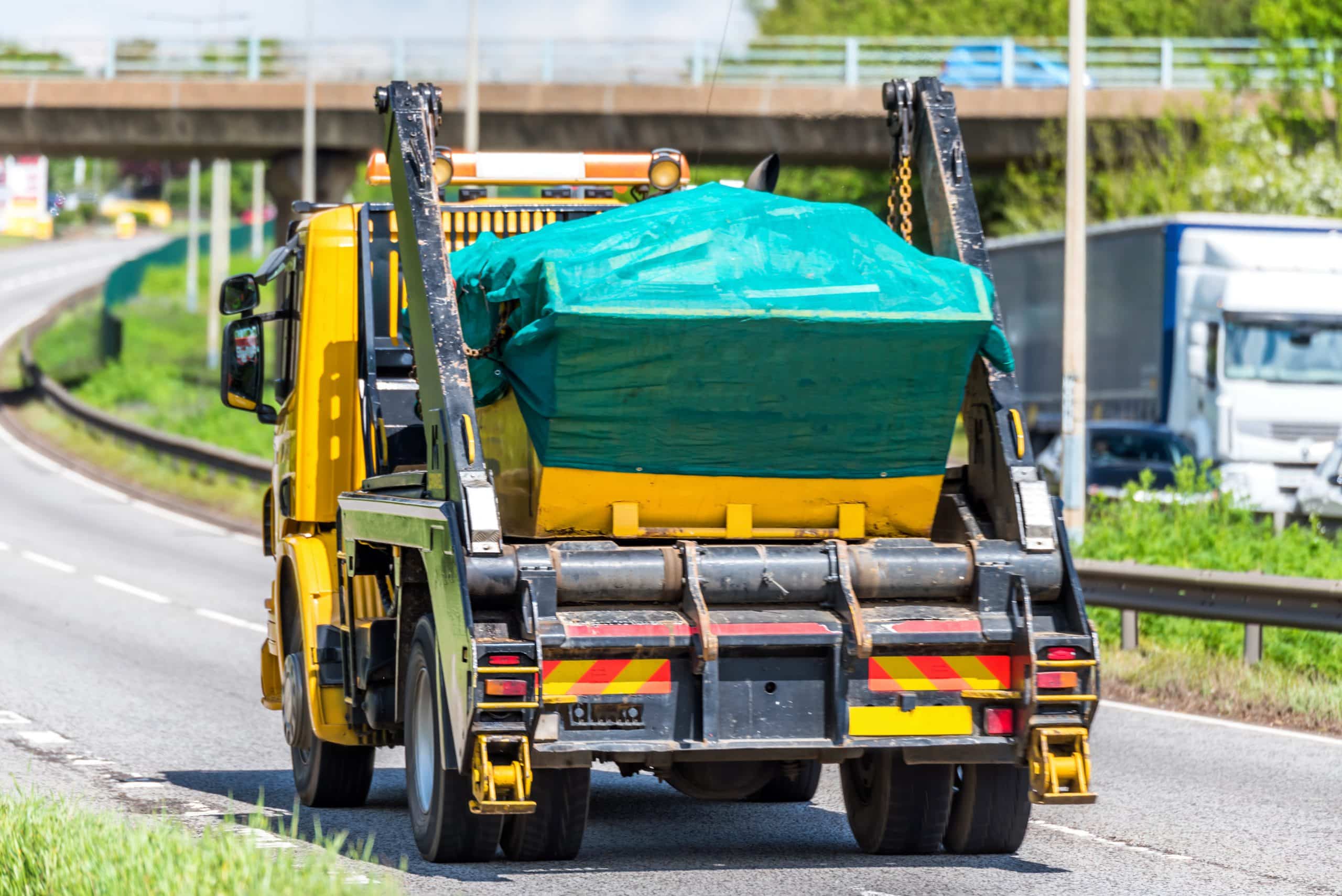 Yellow Skip Delivery Vehicle